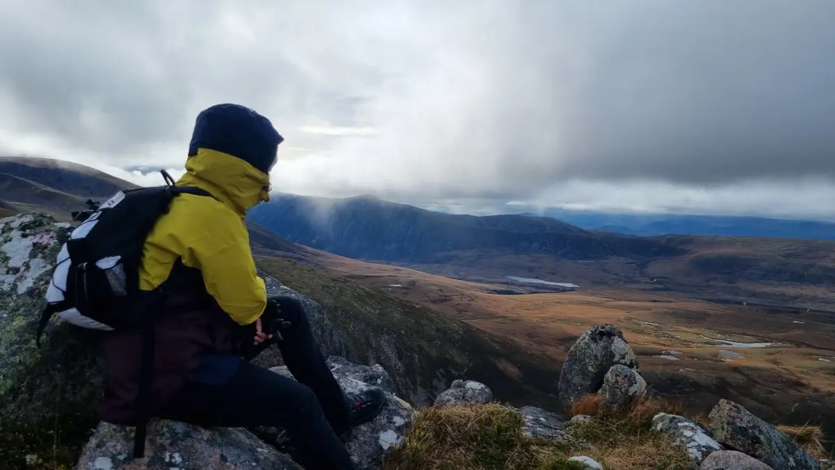 hiker with cloudy view from summit